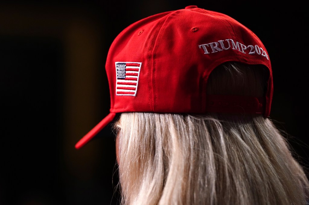 Rep. Marjorie Taylor Greene, R-Ga., wears a red hat in support of Republican presidential candidate former President Donald Trump.