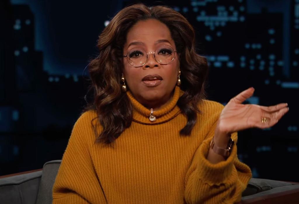 Oprah Winfrey in a yellow sweater speaks to the camera