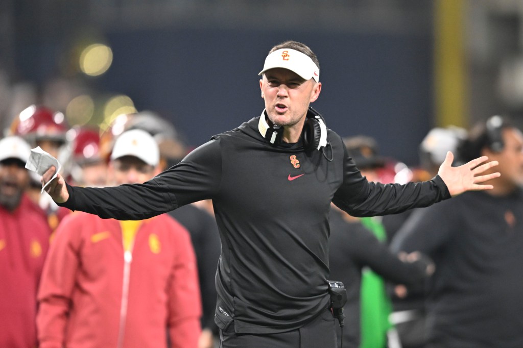 Lincoln Riley yells from sideline in Holiday Bowl NCAA college football game between Southern California and Louisville.