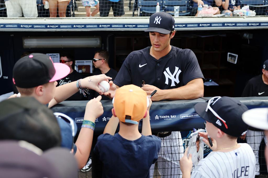 Spencer Jones #70 of the New York Yankees signs autographs prior to the 2024 Spring Breakout Game between the Toronto Blue Jays and the New York Yankees at George M. Steinbrenner Field on Saturday, March 16, 2024 in Tampa Bay, Florida. 