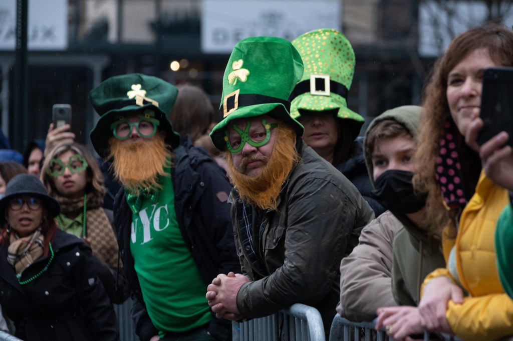 St. Patrick's Day revelers wait during the annual parade in New York City in 2022.