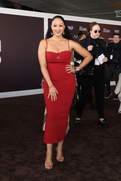 Tamera Mowry in a red dress attending the ESSENCE Black Women In Hollywood Awards at Academy Museum of Motion Pictures.