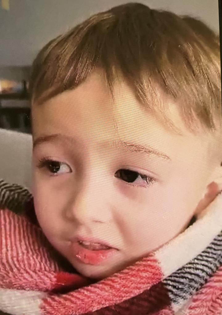 Elijah Vue wrapped in the red and white blanket.