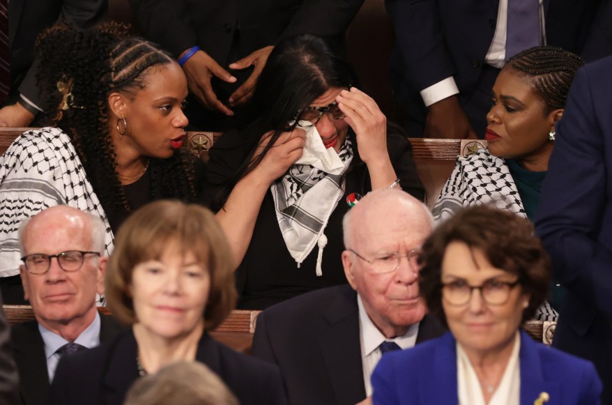 Rashida Tlaib (D-MI) wipes her eyes as she listens to President Joe Biden's State of the Union address.