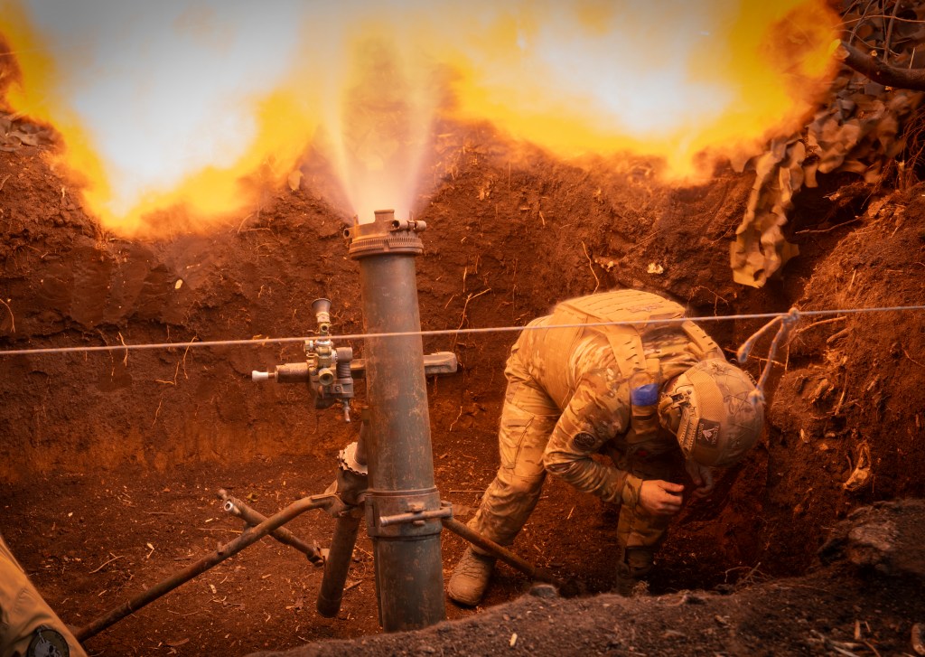 Ukrainian servicemen of the 28th Separate Mechanised Brigade fires a 122mm mortar towards Russian positions at the front line, near Bakhmut, Donetsk region, Ukraine, Sunday, March 3, 2024. 