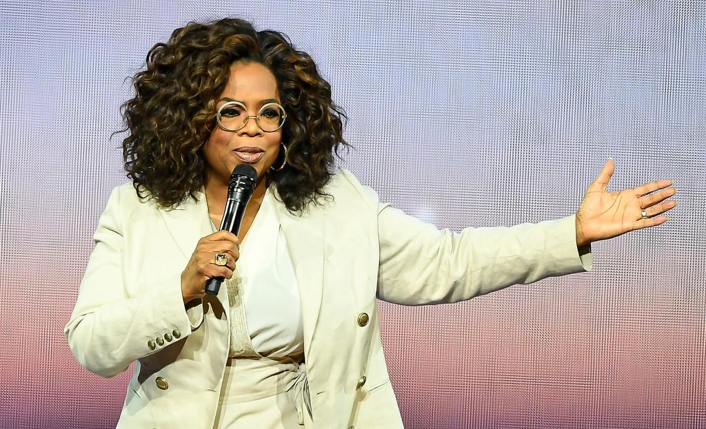 Oprah Winfrey speaking into a microphone at Oprah's 2020 Vision: Your Life in Focus Tour in San Francisco, California.