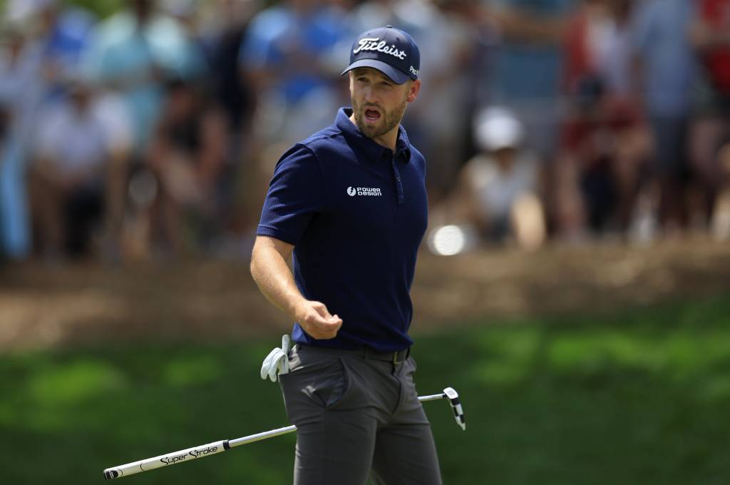 Wyndham Clark talks on the ninth hole during the second round of The Players Championship PGA golf tournament.