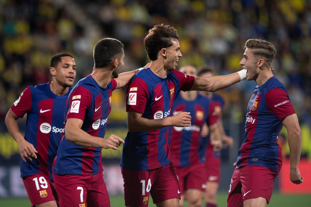 Barcelona forward #14 Joao Felix celebrates after scoring with teammates during the Spanish league football match between Cadiz CF and FC Barcelona at the Nuevo Mirandilla stadium in Cadiz on April 13, 2024.