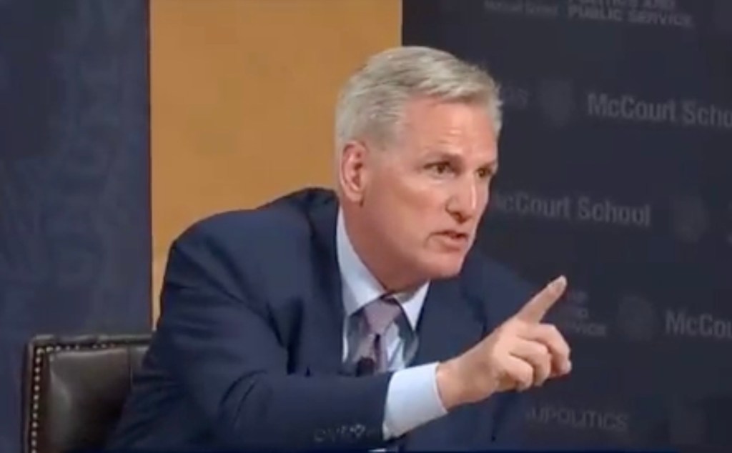 Kevin McCarthy, in a suit, pointing his finger while speaking at an event at Georgetown University