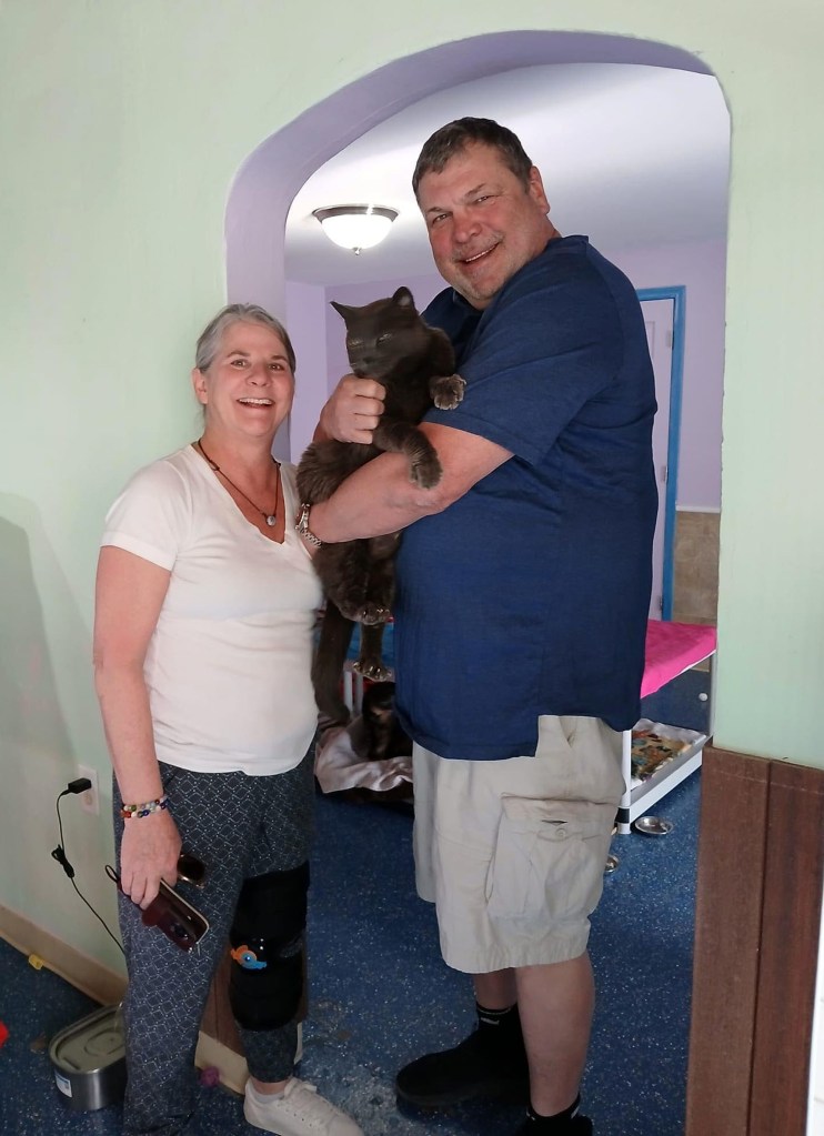 Cindy and Jeff Hall were reunited with their cat, Sam, after he went missing five years ago.