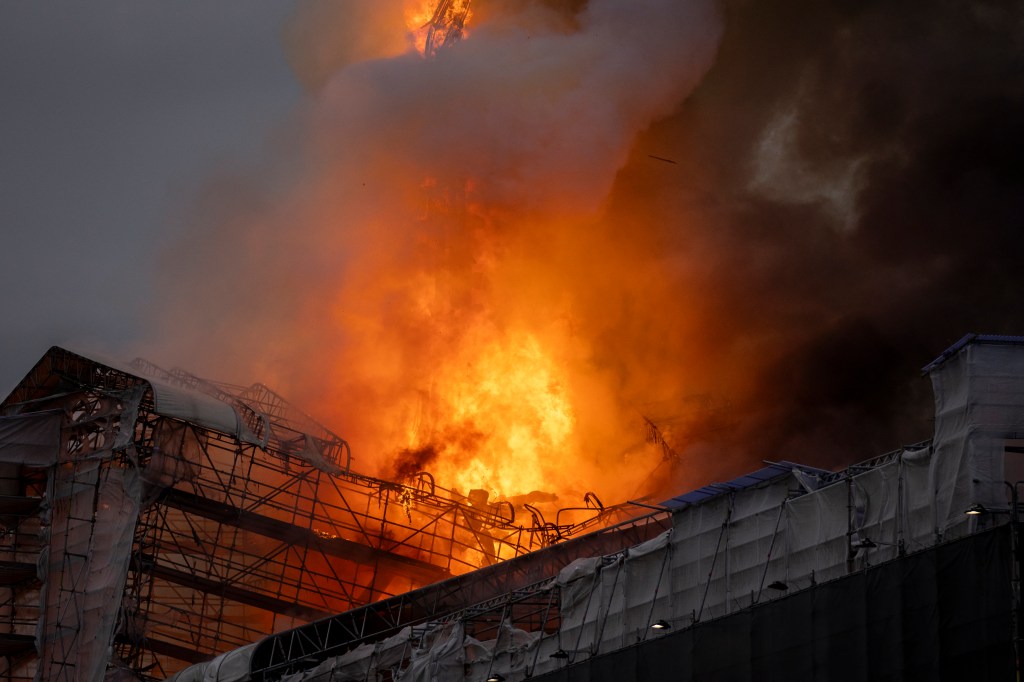 Flames bursting from the historic Boersen stock exchange building in central Copenhagen, Denmark, one of the city's oldest buildings, during a fire on April 16, 2024.