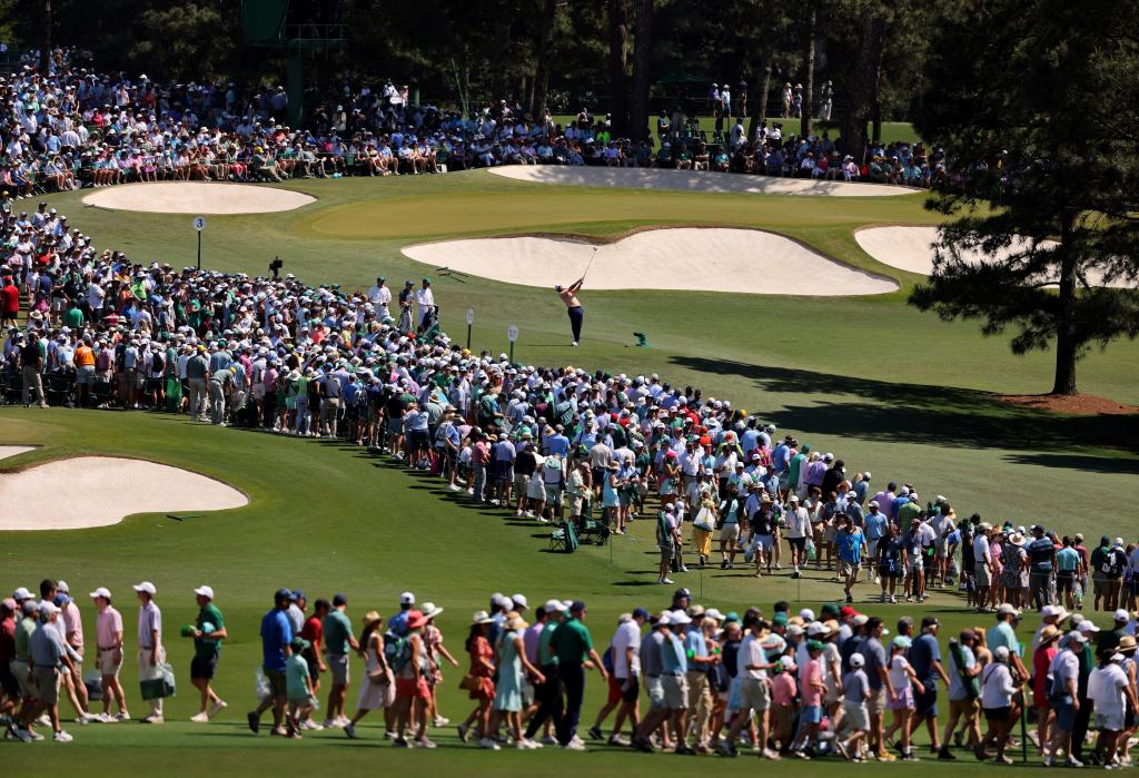 General view as Scottie Scheffler of the U.S. hits his tee shot on the 3rd hole during the final round of The Masters.