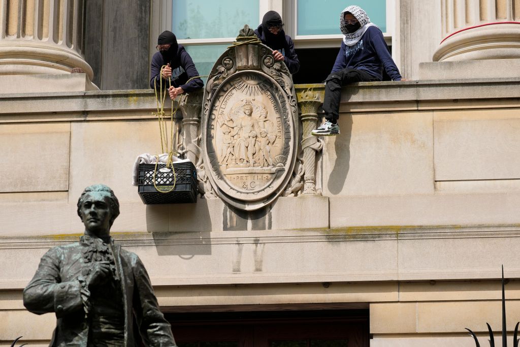 Pro-Palestine student protestors carrying supplies into Hamilton Hall at Columbia University during a protest against the war in Gaza, New York City, April 30, 2024.