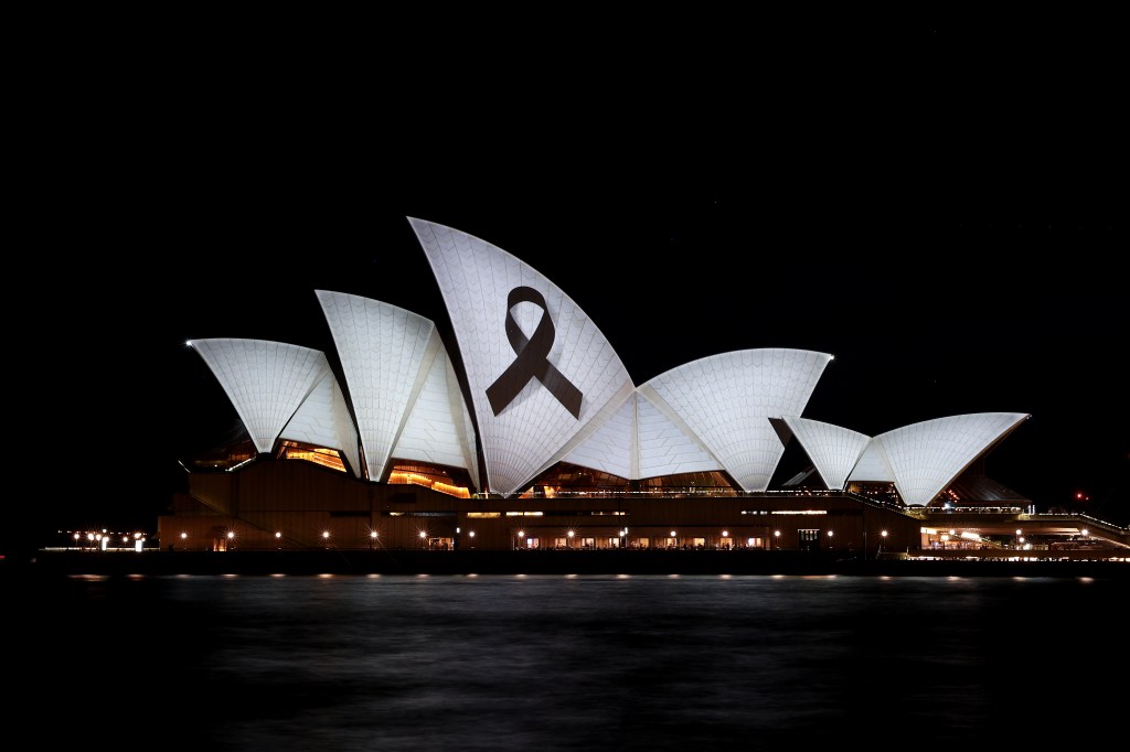 A black ribboned displayed on the Sydney Opera House to honor the victims.