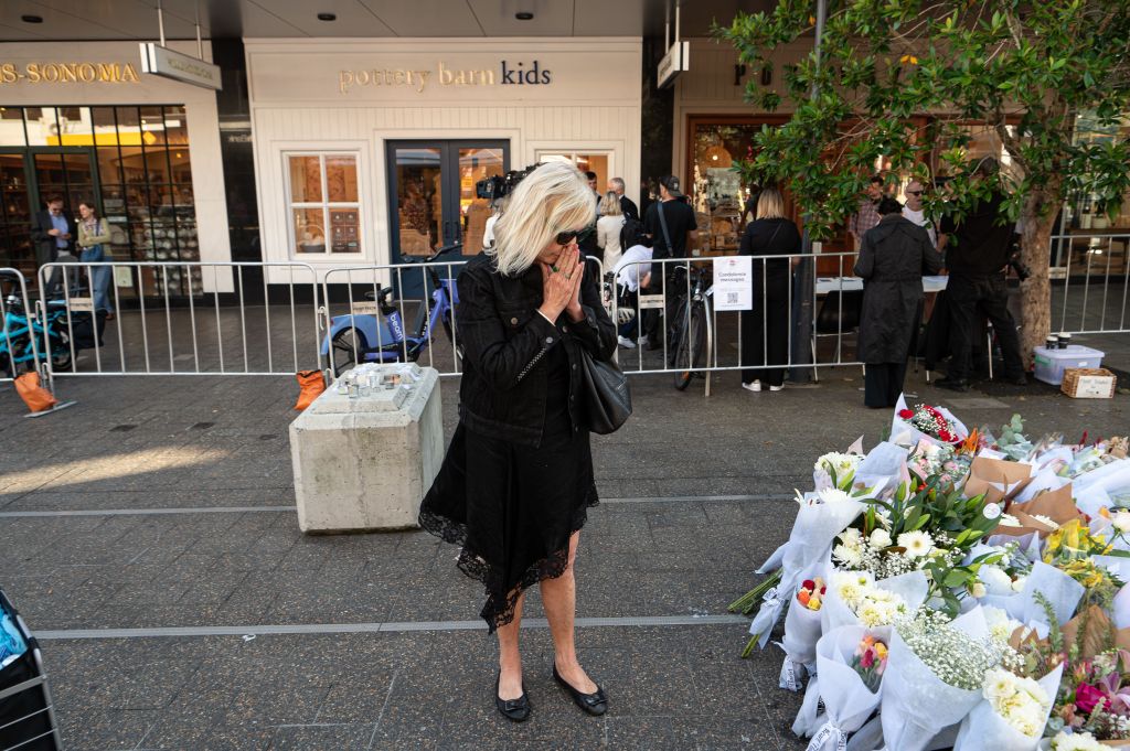 A woman visiting a memorial for the victims of the attack.