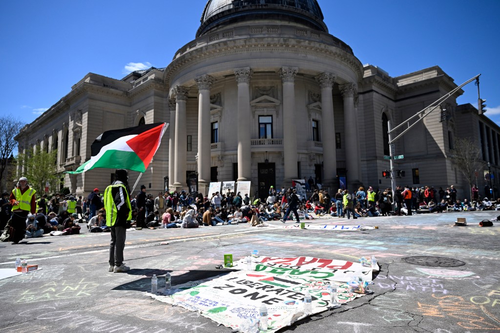 300 pro-Palestinian peaceful protesters occupying the plaza and blocking the intersection outside the Yale College Dean's Office building