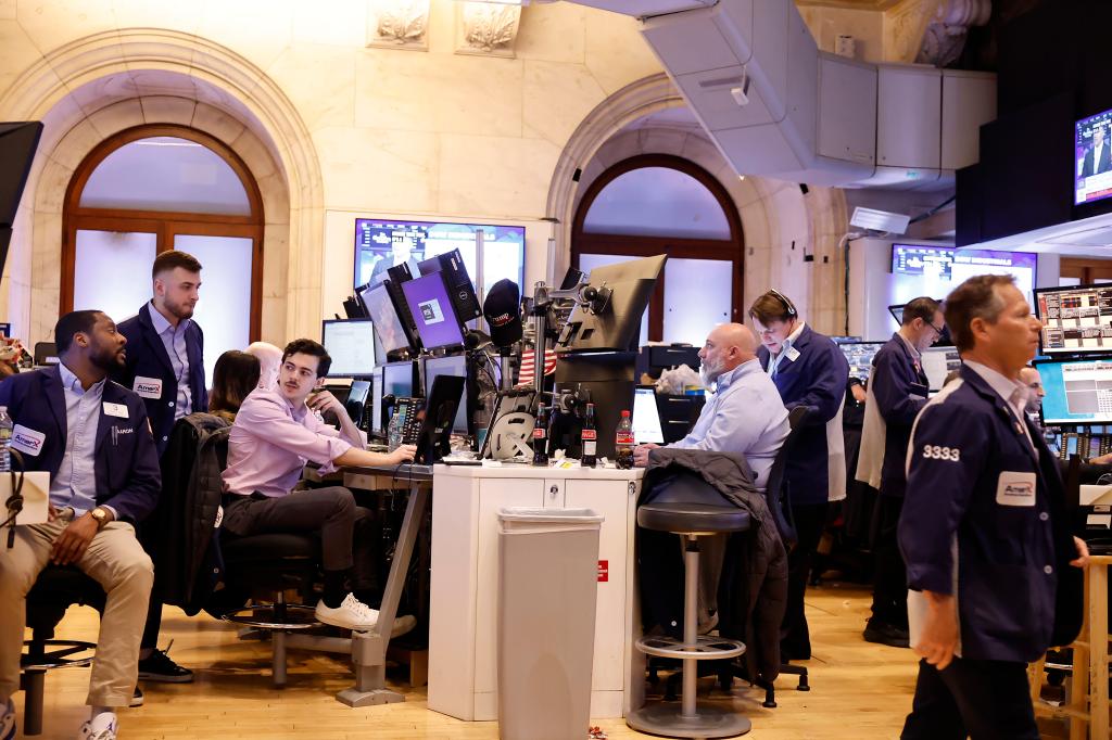 Traders work on the floor of the New York Stock Exchange