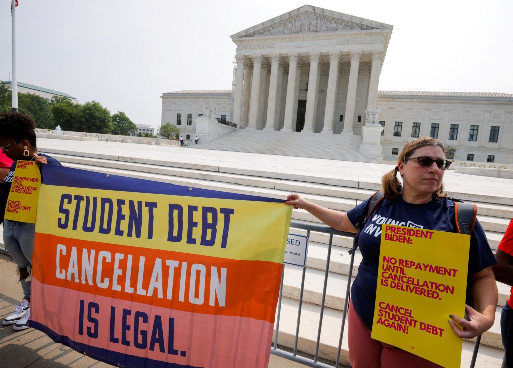 Supporters of U.S. President Joe Biden's plan to cancel $430 billion in student loan debt react outside the U.S. Supreme Court, after the court ruled against Biden in a 6-3 decision favoring six conservative-leaning states that objected to the policy, in Washington, U.S. June 30, 2023.