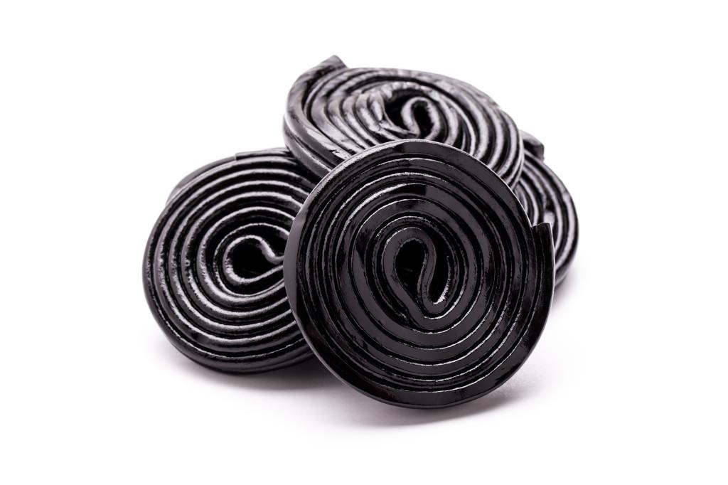 Licorice wheels on white background.