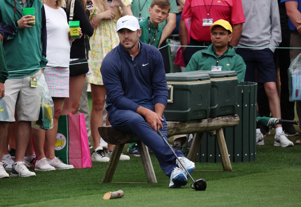 Brooks Koepka watches others tee off on the eighth hole during his Masters practice round.