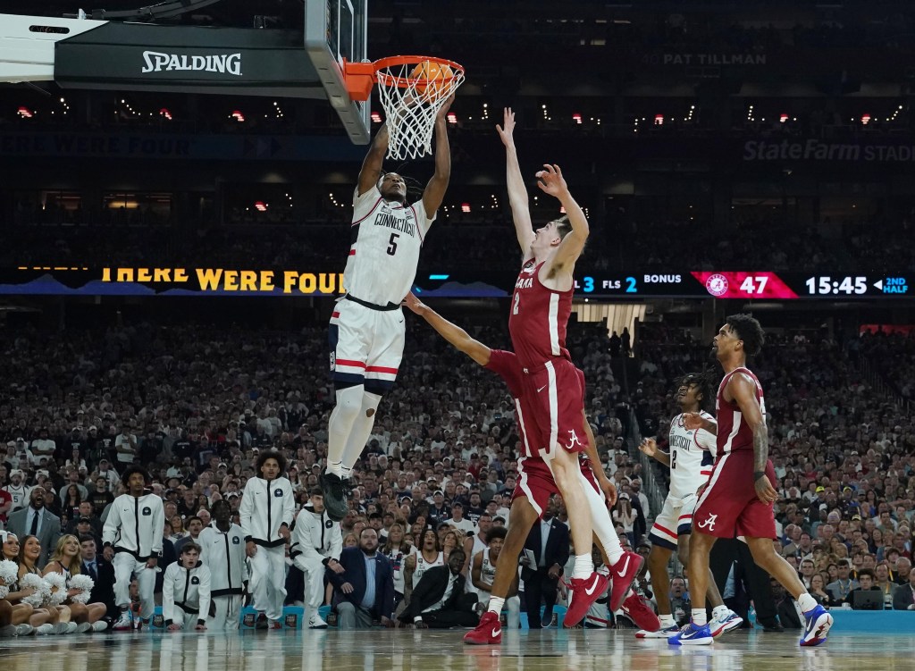 Stephon Castle, who scored a team-high 21 points, slams home a dunk during UConn's 86-72 Final Four win over Alabama.