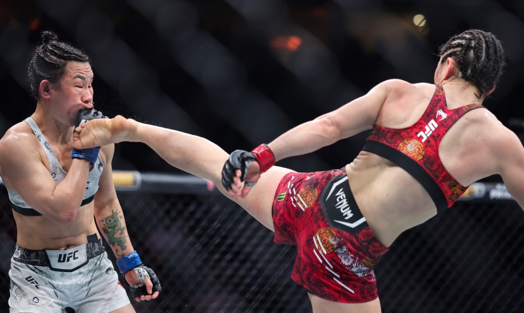 Zhang Weili kicks Arman Tsarukyan during her win at UFC 300.