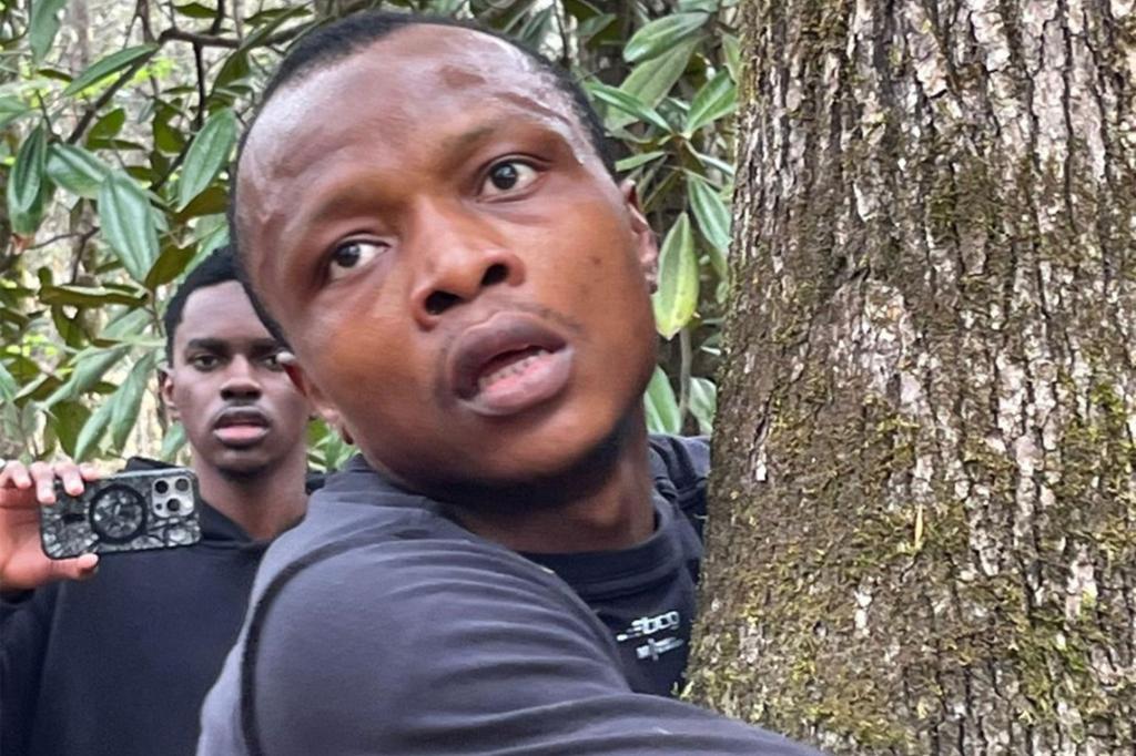 Abubakar Tahiru hugging a tree.