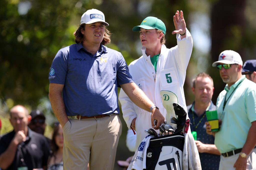 Amateur golfer Neal Shipley and his caddie lining up a shot at the third round of the 2024 Masters Tournament