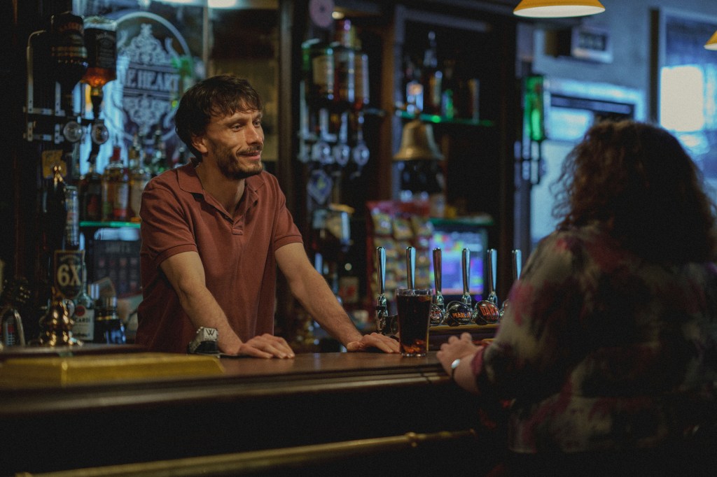 Donny and Martha in "Baby Reindeer" standing in a bar. 