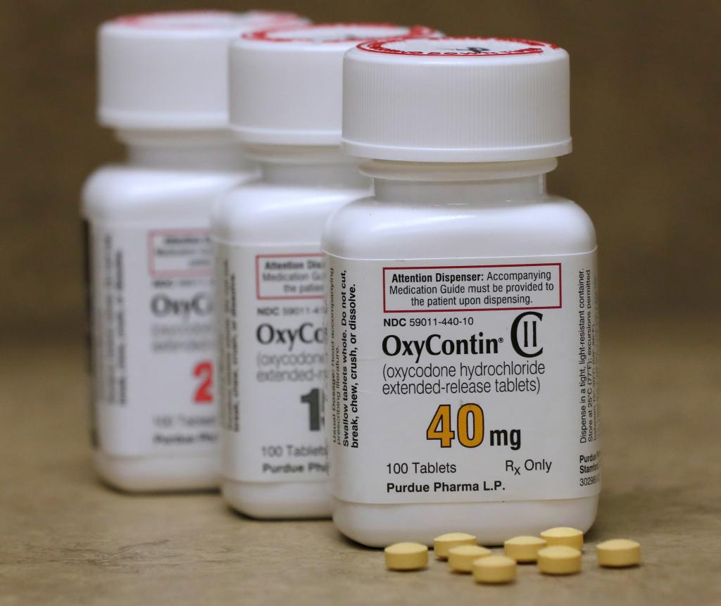 Bottles of OxyContin pills, a prescription painkiller, by Purdue Pharma LP on a pharmacy counter in Provo, Utah, USA