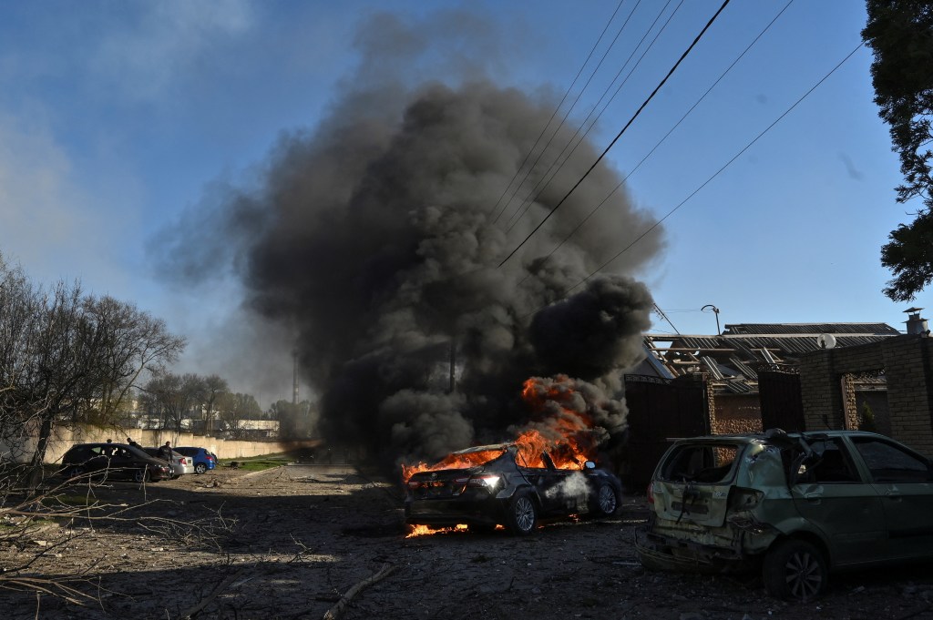 A car burns at a site of a Russian missile strike, amid Russia's attack on Ukraine.