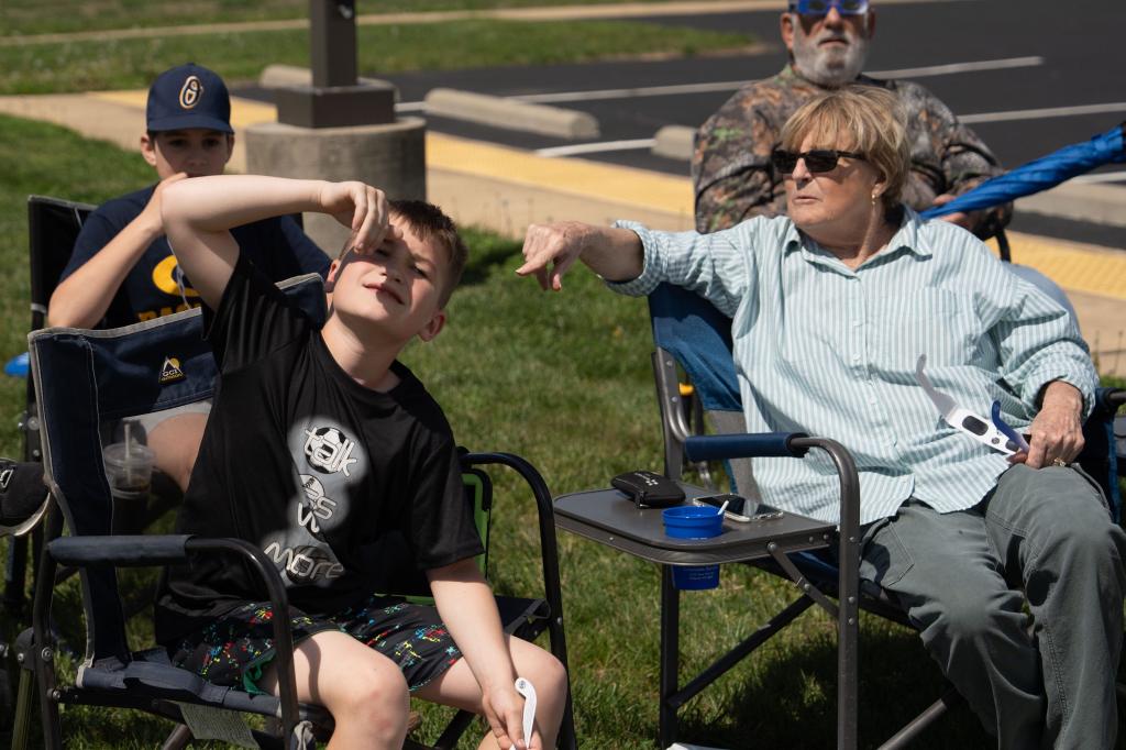 Cathi Hard scolding young Colten Muller for viewing solar eclipse without protective glasses at McCracken County Extension Office event