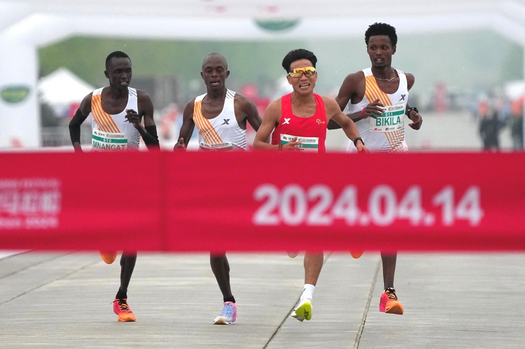All four runners, including He, were disqualified and forced to return their medals and award money. 