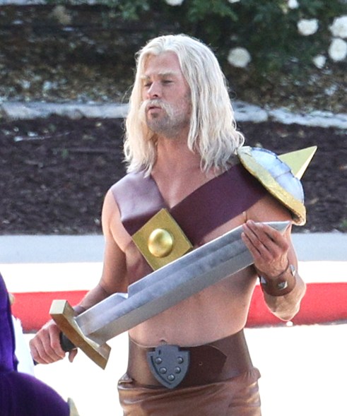 Chris Hemsworth in costume with a sword on his back on the set of a 'Clash Of Clans' commercial in Los Angeles.