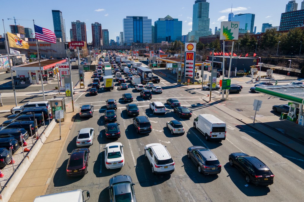 Cars line up on the New Jersey side of the Hudson River to drive through the Holland Tunnel and head into Manhattan. 