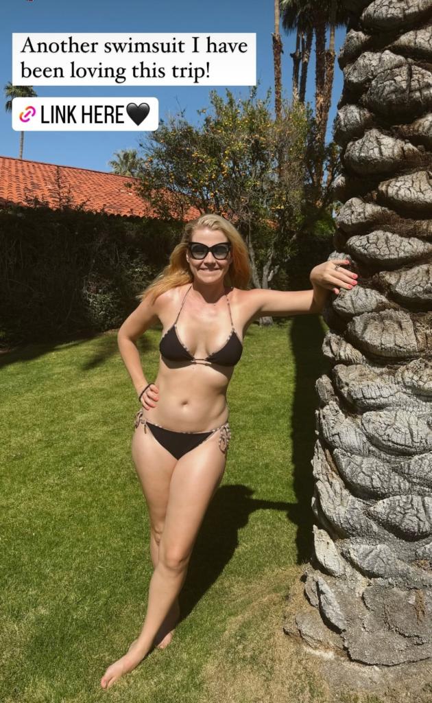 Elizabeth Smart in a black bikini, leaning against a tree and enjoying a family vacation in Palm Springs, California