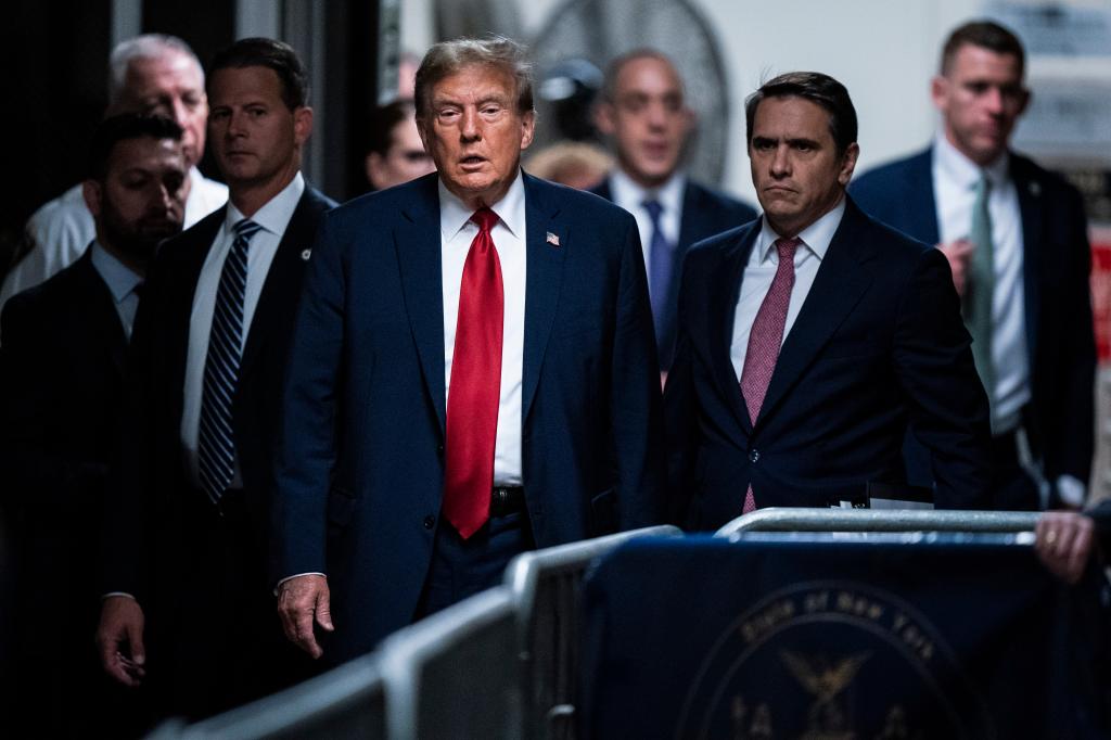 Former President Donald Trump arriving at Manhattan criminal court with his legal team