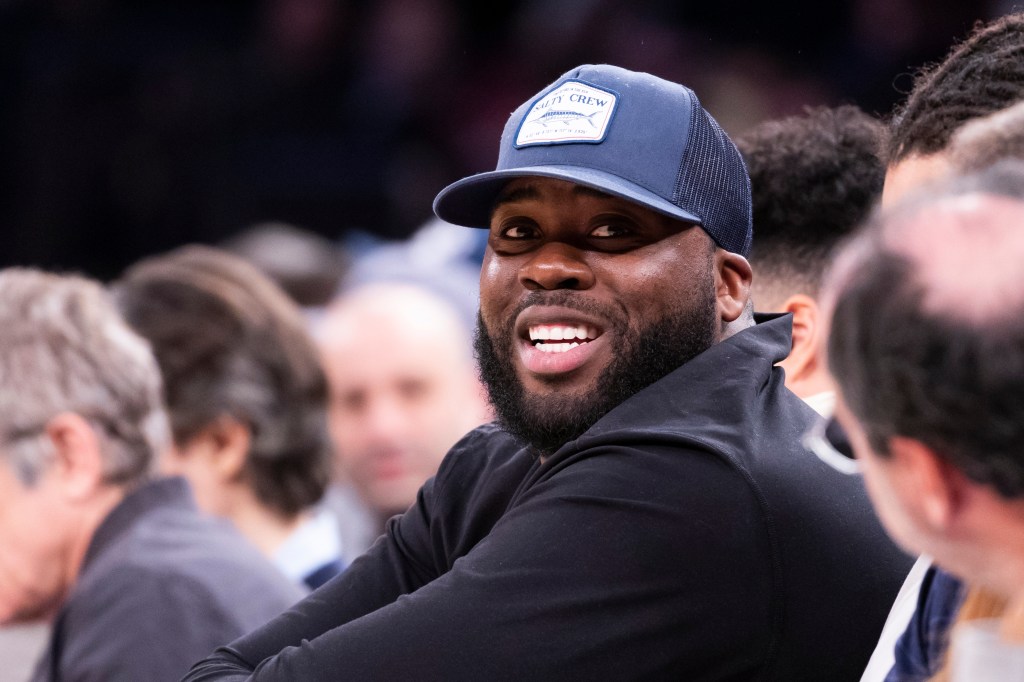 Giants' Korey Cunningham sits court side in the second half at Madison Square Garden