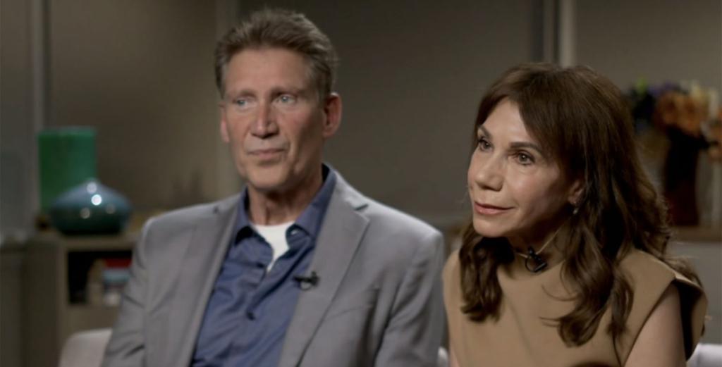 Man and woman, Gerry Turner and Theresa Nist, sitting in a room, known as 'Golden Bachelor' couple, announcing divorce