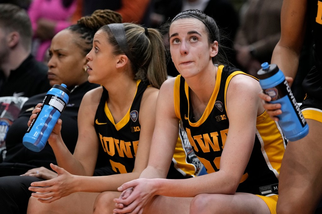 Caitlin Clark sits on the bench during Iowa's loss to South Carolina on Sunday.