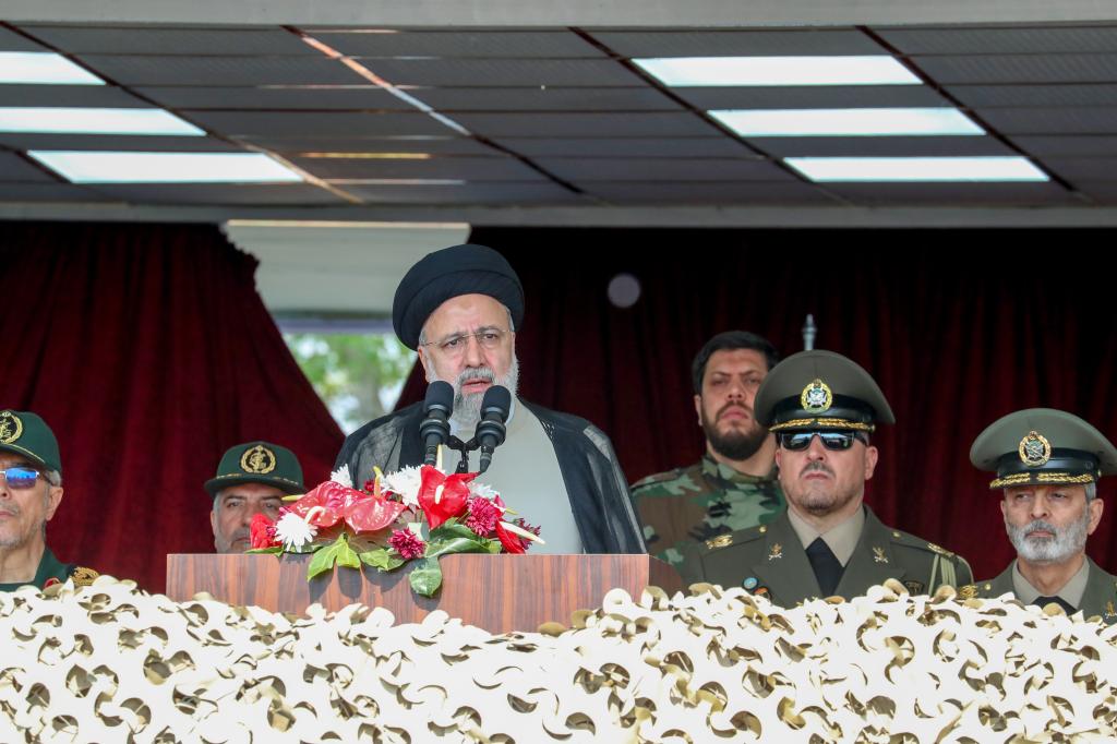 Iran's President Ebrahim Raisi attends a military parade alongside high-ranking officials and commanders during a ceremony marking the country's annual army day on April 17, 2024