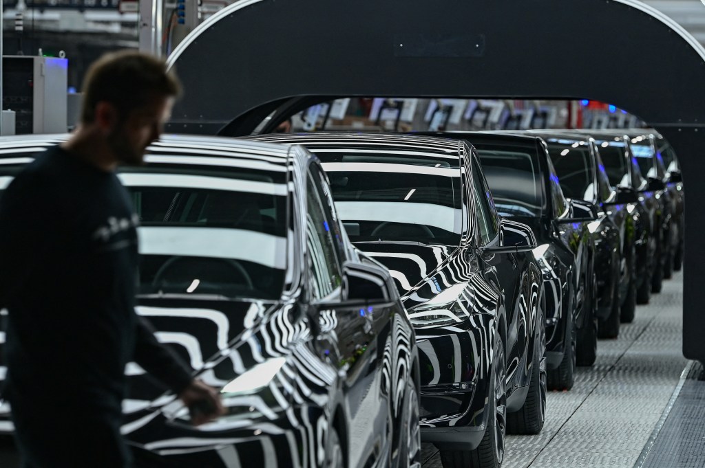 A line of Tesla Model Y electric vehicles at the Gigafactory in Gruenheide, Germany