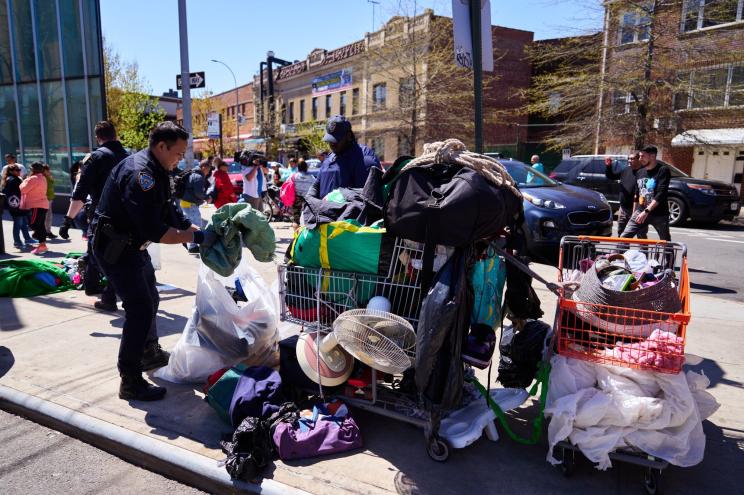 New York City Police Department conducted a raid and confiscated clothing, shoes, bags and other items from vendors who were selling items on the sidewalk near the intersection of Elmhurst Avenue and Roosevelt Avenue on Tuesday, April 16, 2024.