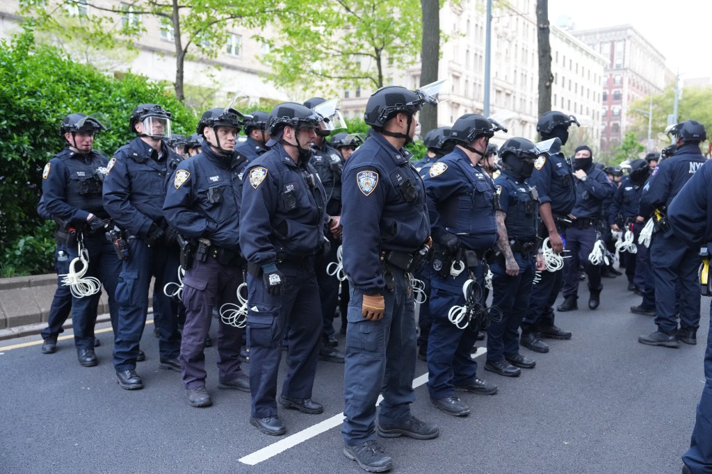 New York Police Department officers preparing to clear a pro-Palestinian encampment on the lawn of Columbia University, 2024