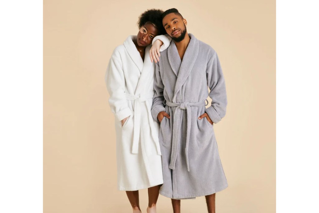 A man and woman wearing bathrobes