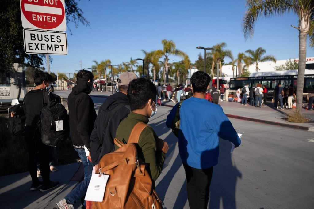 Migrants being dropped off by Border Patrol at the Iris Transit Centre in San Diego, onward travel facilitated by NGO volunteers.