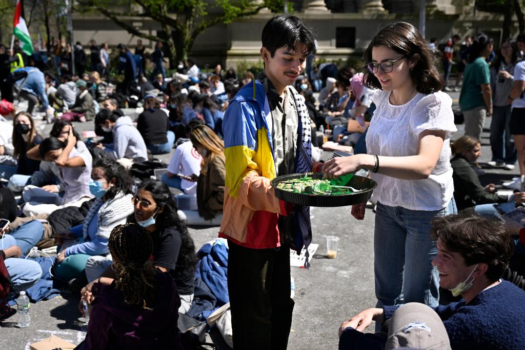 A man passing out sushi to the protestors at Yale.