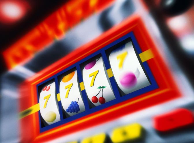 Fruit machine bars spinning to line of 7's (Digital Composite)