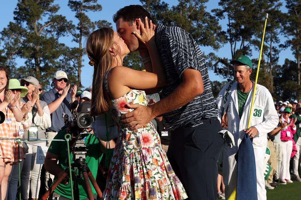 Meredith and Scottie Scheffler kissed at Augusta National in April 2022 after his first Masters win.