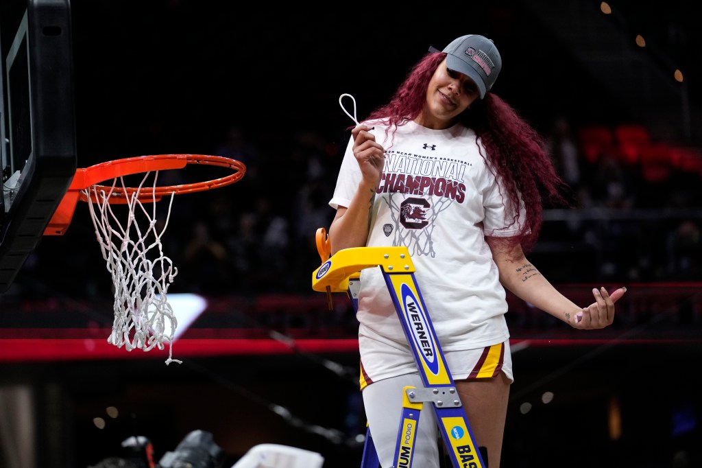 South Carolina's Kamilla Cardoso cuts down the net after their national championship win over Iowa on Sunday.